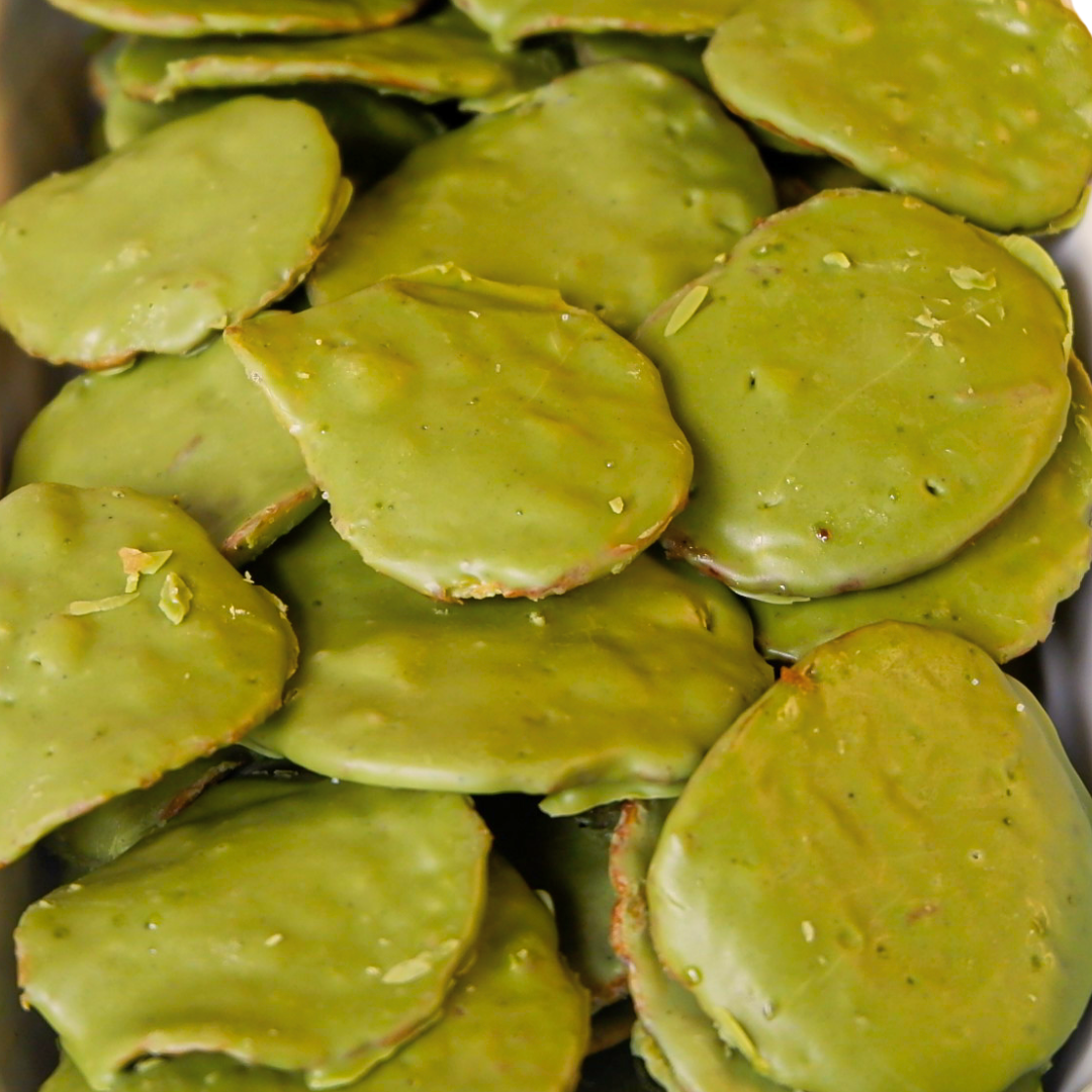 Close up of Matcha Green chocolate-covered potato chip with a textured surface